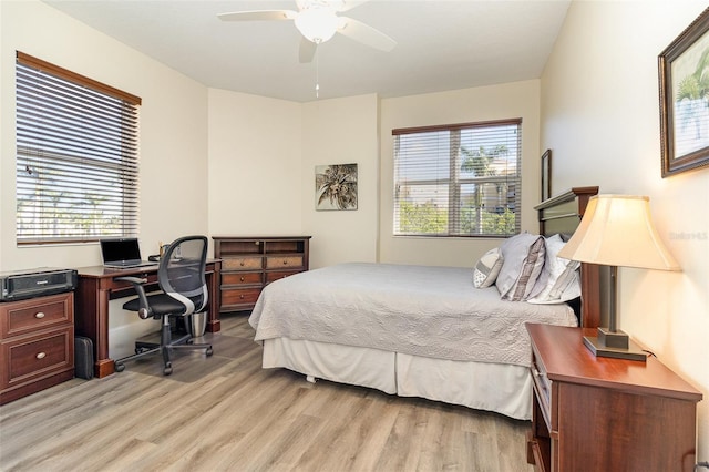 615 Riviera Dunes Way Unit 208, Palmetto, FL 34221 - bedroom with light wood-type flooring, an office area, and ceiling fan