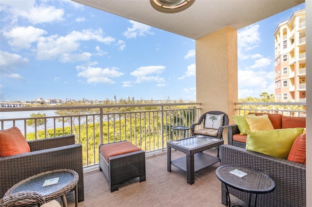 615 Riviera Dunes Way Unit 208, Palmetto, FL 34221 - balcony featuring a water view and an outdoor living space