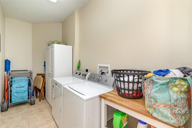 615 Riviera Dunes Way Unit 208, Palmetto, FL 34221 - laundry area featuring separate washer and dryer and light tile patterned floors