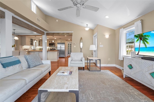 111 Faubel St, Sarasota, FL 34242 - living room with vaulted ceiling, baseboards, light wood finished floors, ceiling fan, and visible vents