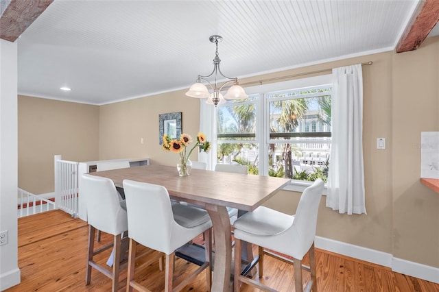 111 Faubel St, Sarasota, FL 34242 - dining room with recessed lighting, crown molding, baseboards, and wood finished floors