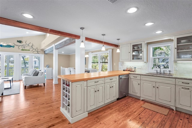 111 Faubel St, Sarasota, FL 34242 - kitchen featuring butcher block countertops, dishwasher, a sink, open floor plan, and vaulted ceiling with beams