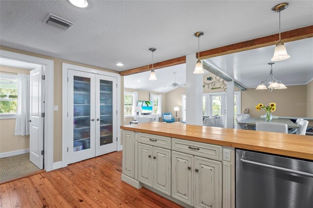111 Faubel St, Sarasota, FL 34242 - kitchen featuring french doors, wooden counters, stainless steel dishwasher, and visible vents