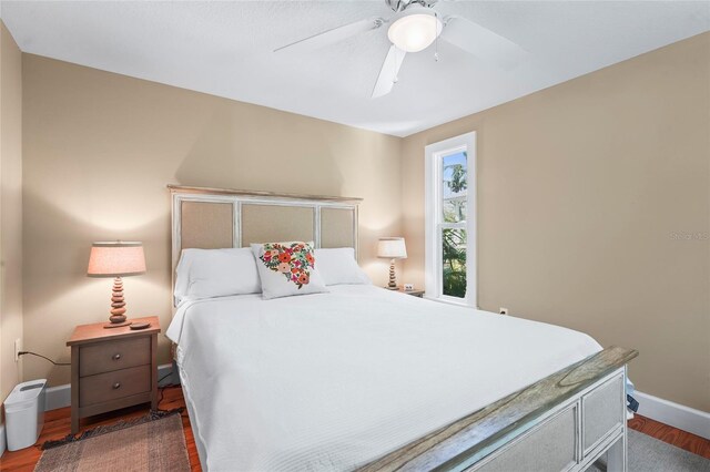 111 Faubel St, Sarasota, FL 34242 - bedroom with baseboards, ceiling fan, and wood finished floors