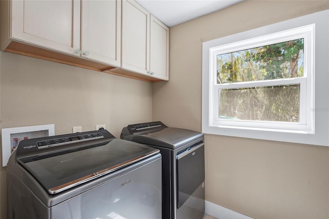 111 Faubel St, Sarasota, FL 34242 - washroom with cabinet space and washer and dryer