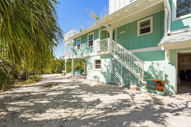 111 Faubel St, Sarasota, FL 34242 - exterior space featuring driveway and board and batten siding