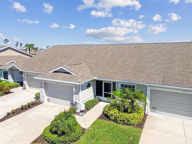 single story home featuring stucco siding, an attached garage, driveway, and a shingled roof