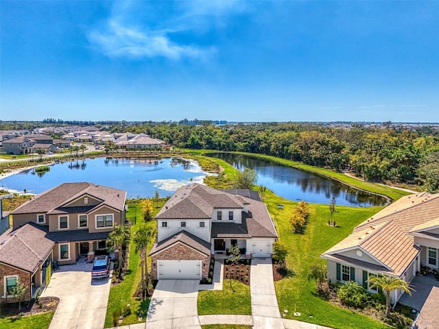 bird's eye view with a residential view and a water view