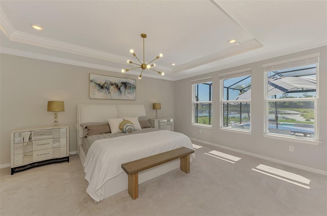 bedroom featuring baseboards, crown molding, a chandelier, and a tray ceiling