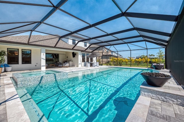 view of pool with a patio area, an outdoor hangout area, glass enclosure, and a pool with connected hot tub
