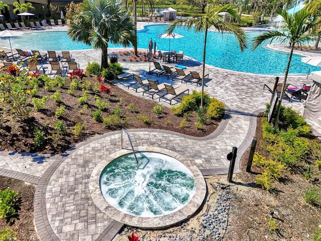 pool featuring a patio area and a community hot tub