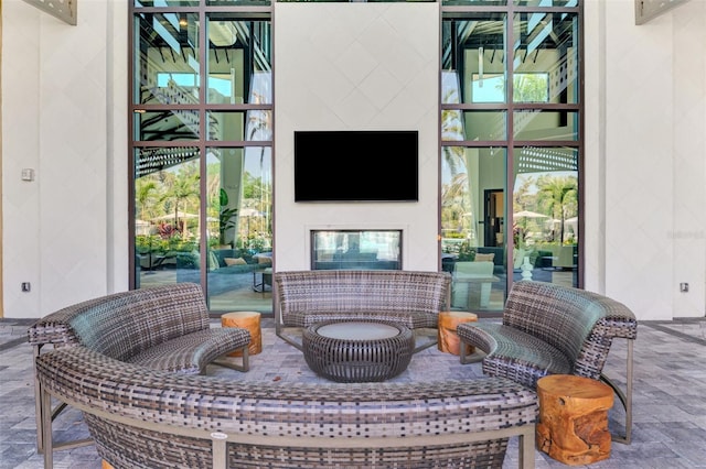 view of patio featuring a glass covered fireplace