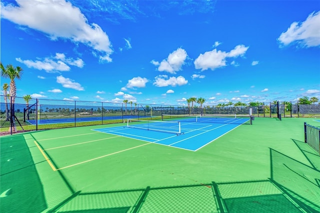 view of sport court with fence