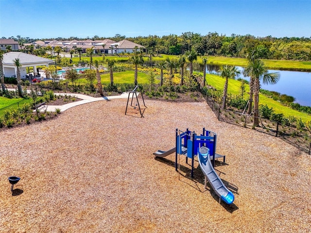 view of property's community with a water view and playground community