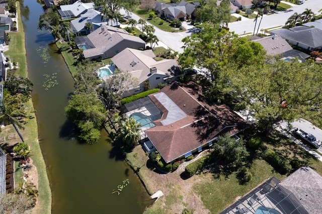 bird's eye view featuring a water view and a residential view