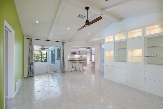 unfurnished living room with vaulted ceiling with beams, visible vents, ceiling fan, and recessed lighting