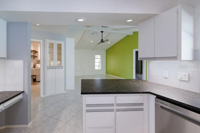 kitchen featuring light tile patterned flooring, lofted ceiling with beams, dishwasher, a peninsula, and white cabinets