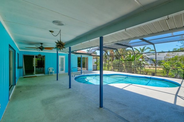 outdoor pool with a ceiling fan, a lanai, and a patio