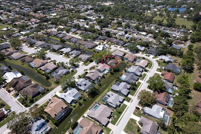 bird's eye view featuring a residential view and a water view