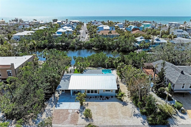 bird's eye view with a residential view and a water view