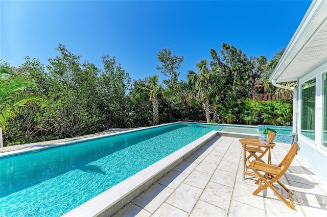 pool with a patio