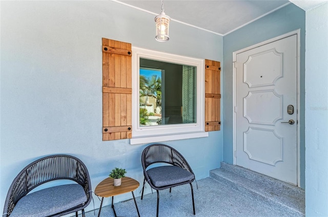 view of exterior entry with stucco siding