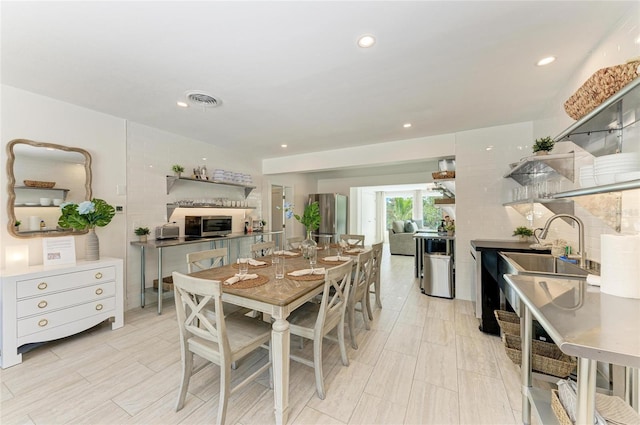 dining space featuring visible vents and recessed lighting