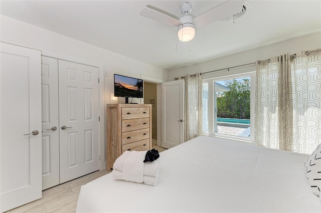 bedroom featuring a closet, a ceiling fan, and access to outside