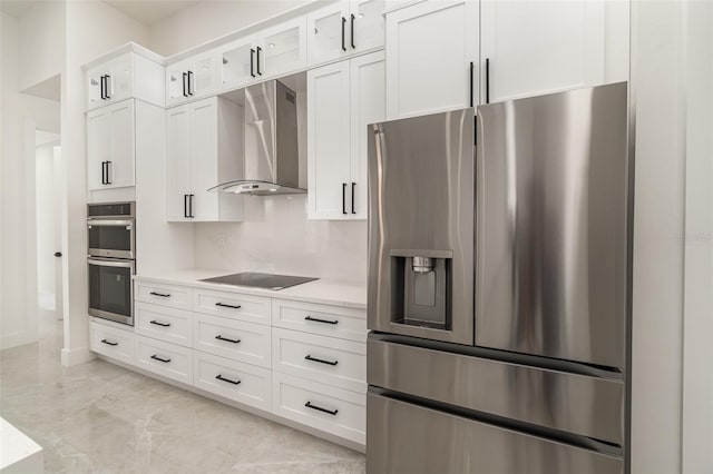 1815 SW 15th Pl, Cape Coral, FL 33991 - kitchen with stainless steel appliances, wall chimney range hood, light countertops, white cabinets, and baseboards