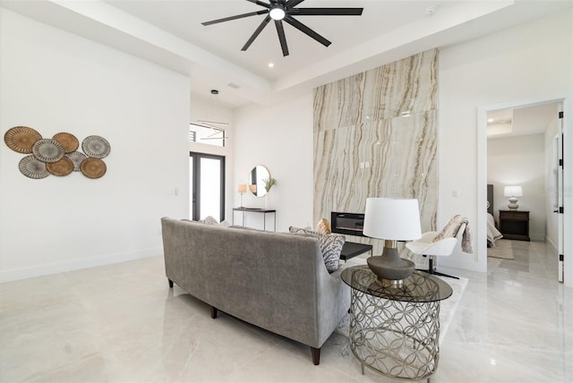 1815 SW 15th Pl, Cape Coral, FL 33991 - living area featuring a ceiling fan, baseboards, and light marble finish floors
