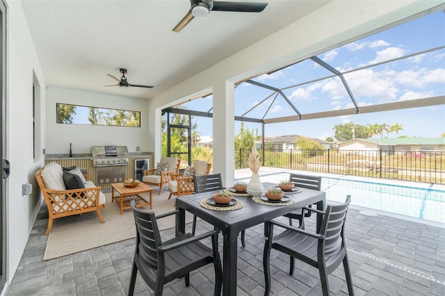1815 SW 15th Pl, Cape Coral, FL 33991 - view of patio featuring a ceiling fan, an outdoor kitchen, wine cooler, and glass enclosure