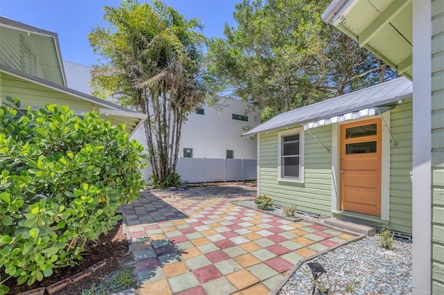 view of patio featuring fence