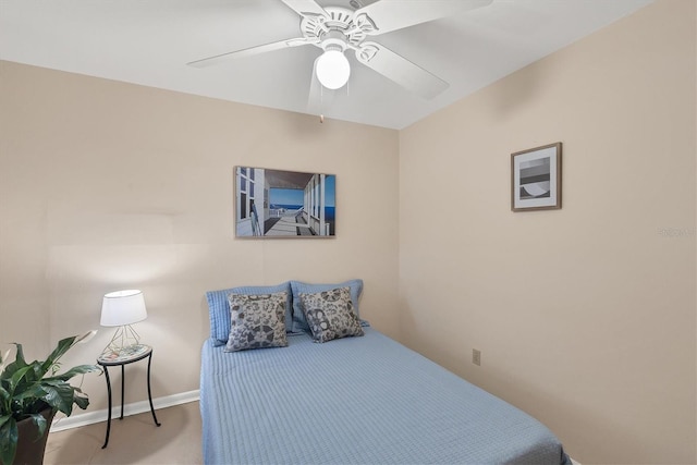 carpeted bedroom with baseboards and a ceiling fan