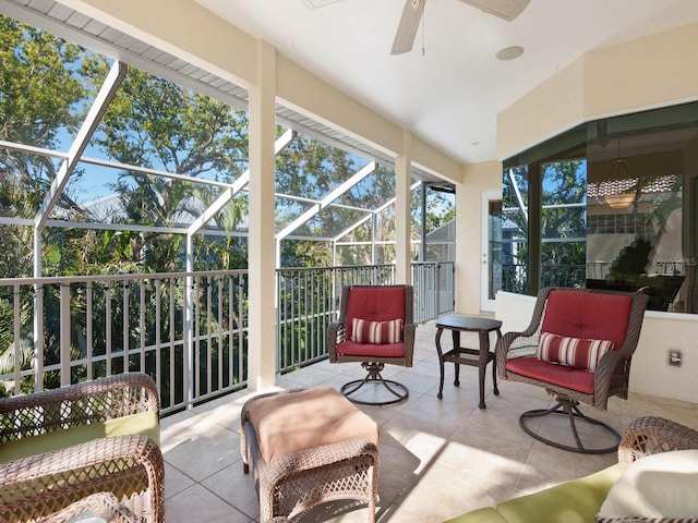 sunroom featuring ceiling fan