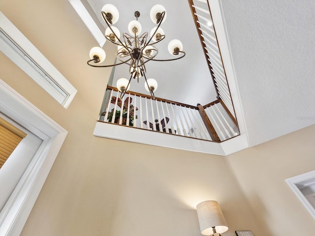 interior details featuring a chandelier
