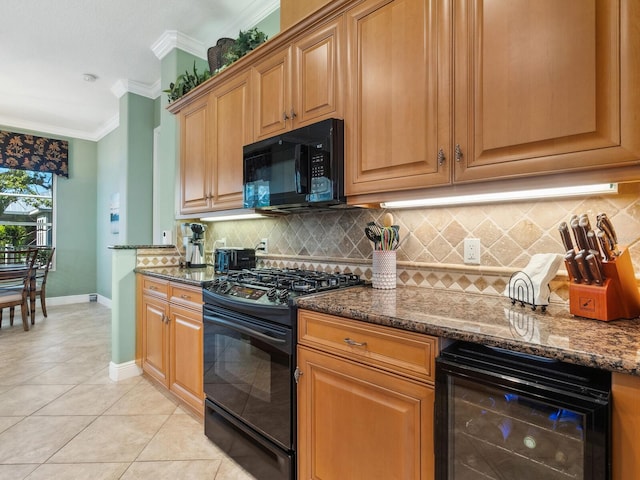kitchen with black appliances, dark stone counters, crown molding, and beverage cooler