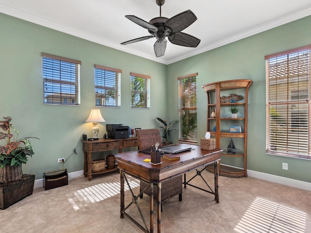 office space with baseboards, crown molding, light tile patterned floors, and a ceiling fan