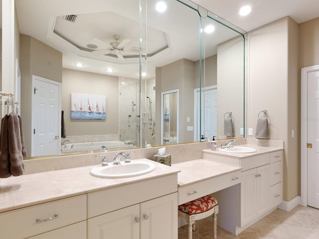 full bath with vanity, a garden tub, a shower stall, a raised ceiling, and ceiling fan
