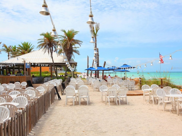exterior space with a water view and outdoor dining space