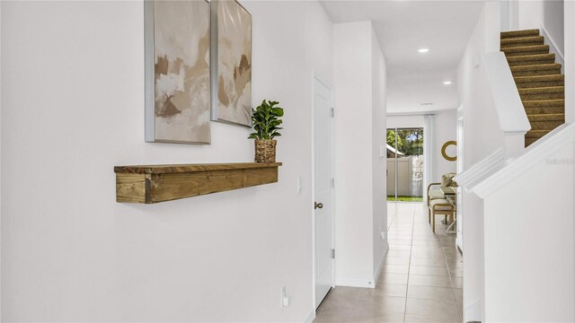 11810 Davis Dr, Largo, FL 33774 - hallway with recessed lighting, stairs, and tile patterned flooring