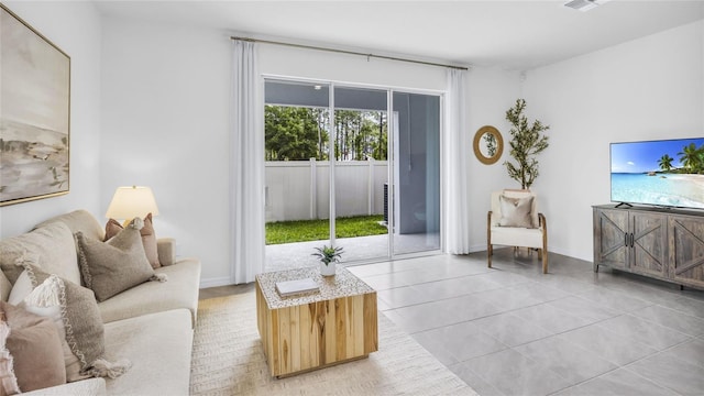11810 Davis Dr, Largo, FL 33774 - living area featuring light tile patterned floors, baseboards, and visible vents