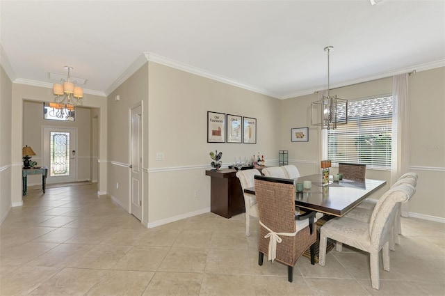 dining space featuring baseboards, ornamental molding, a chandelier, and light tile patterned floors
