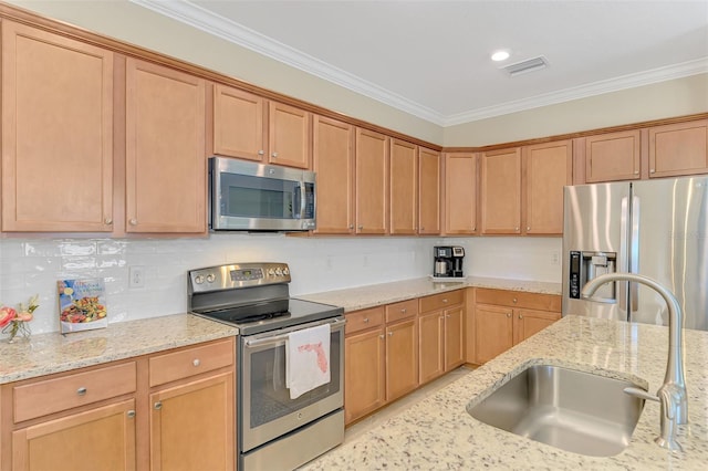 kitchen featuring crown molding, a sink, appliances with stainless steel finishes, visible vents, and decorative backsplash