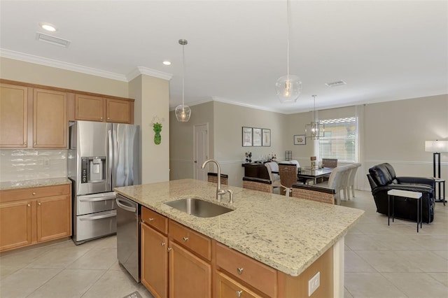 kitchen featuring tasteful backsplash, light tile patterned floors, a sink, visible vents, and appliances with stainless steel finishes