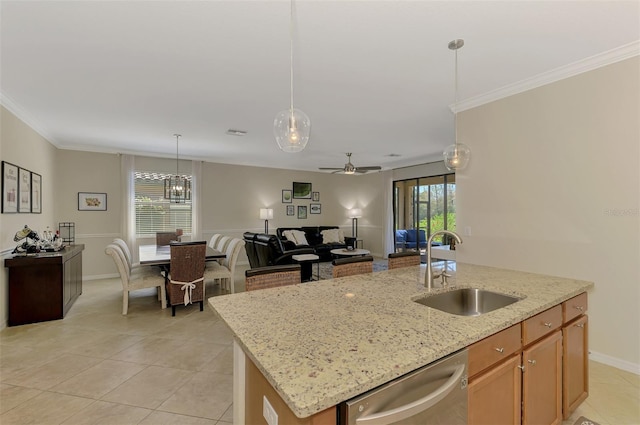 kitchen with a kitchen island with sink, a sink, ornamental molding, and stainless steel dishwasher