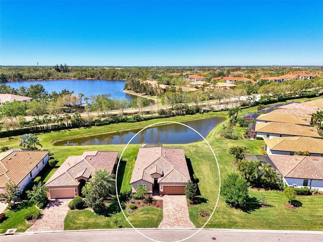 bird's eye view with a residential view and a water view