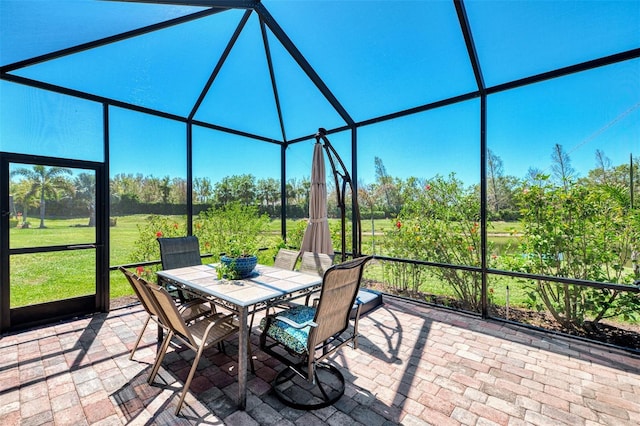 unfurnished sunroom featuring outdoor dining area