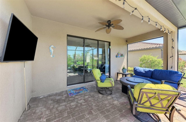 view of patio / terrace with outdoor lounge area and a ceiling fan