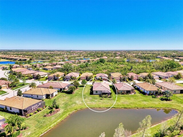 bird's eye view with a residential view and a water view