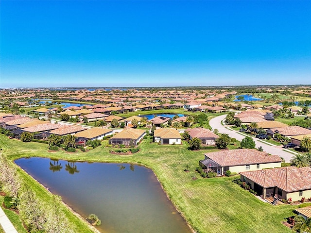 bird's eye view featuring a water view and a residential view